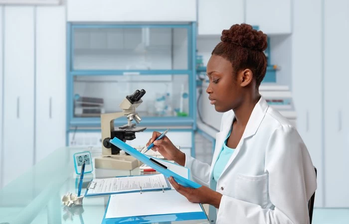 A young scientist working in a lab. 