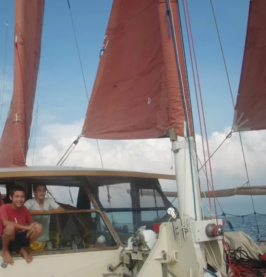 The Springett children looking at the camera on a boat.
