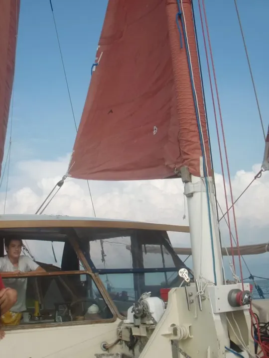 The Springett children looking at the camera on a boat.