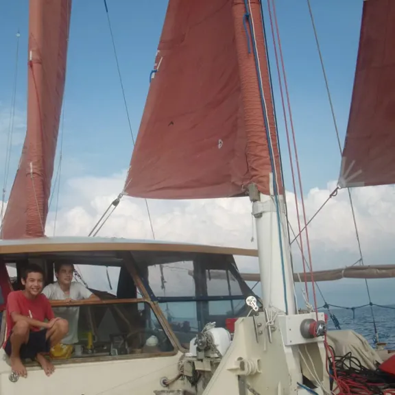 The Springett children looking at the camera on a boat.