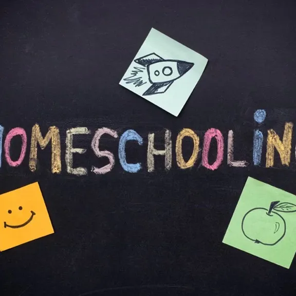 Homeschooling written out on a blackboard.