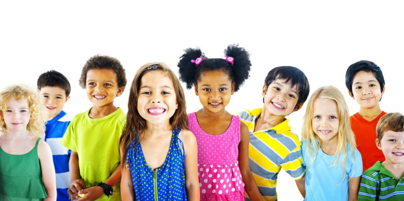 Line-up of cheerful children in brightly coloured clothes, smiling against a white background