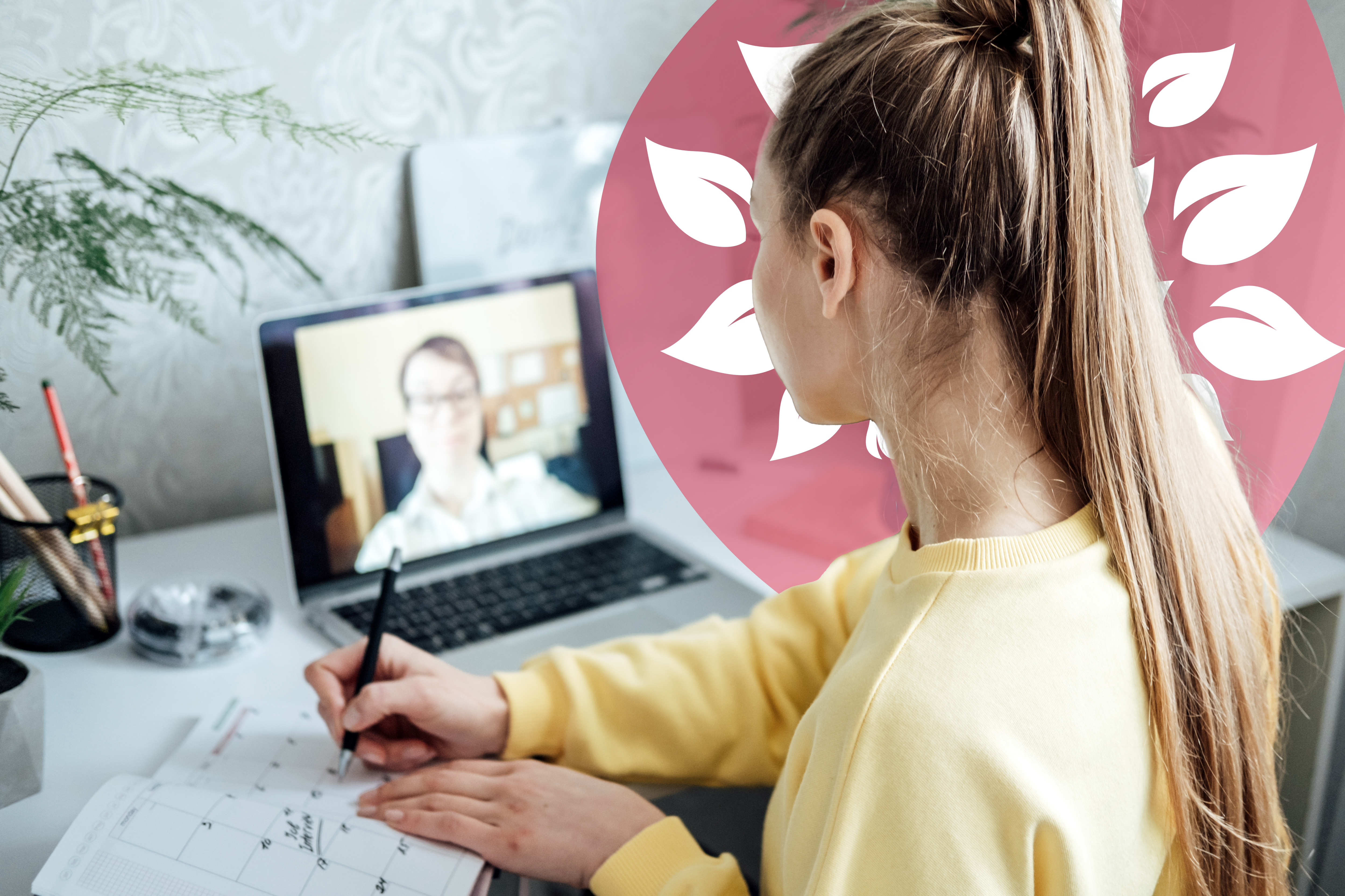 Student taking notes during a virtual lesson with a tutor on a laptop screen
