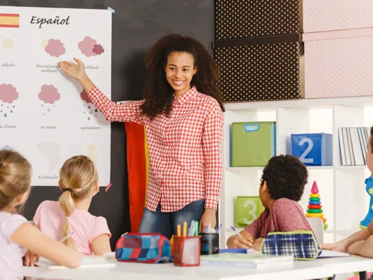 Spanish teacher with students in classroom