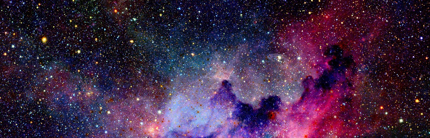 A view of the evening sky, showing vast amounts of stars and colourful arrays of solar gas. 