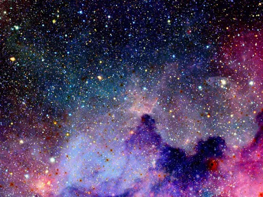 A view of the evening sky, showing vast amounts of stars and colourful arrays of solar gas.