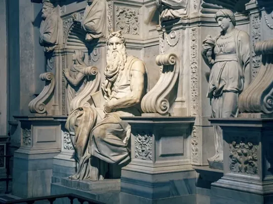 An old Roman statue made from polished marble or granite.