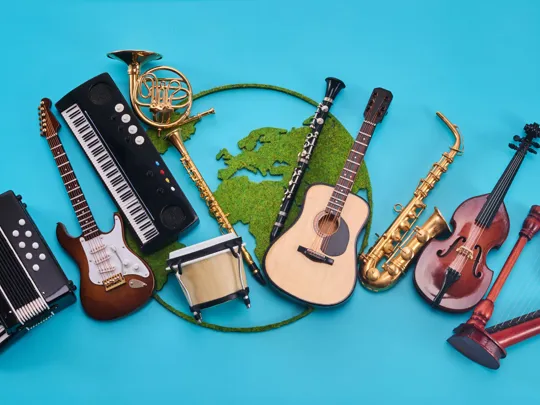 Collection of global musical instruments arranged in a semi-circle on a bright blue background.