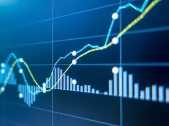 An image of a combined line and bar chart on a blue screen.