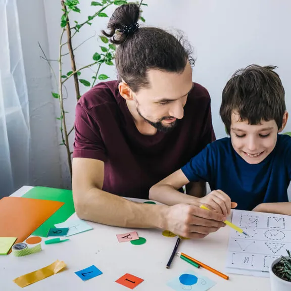 Father and son learning about shapes.