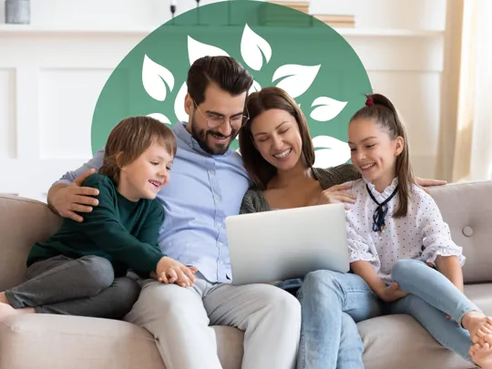 Smiling family engaging with a laptop, representing a positive approach to homeschooling.