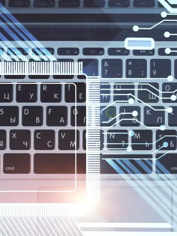 An overhead view of a laptop keyboard and mouse, with digital circuit lines and geometric shapes superimposed on the image. The image is an abstract representation of computer science and technology.